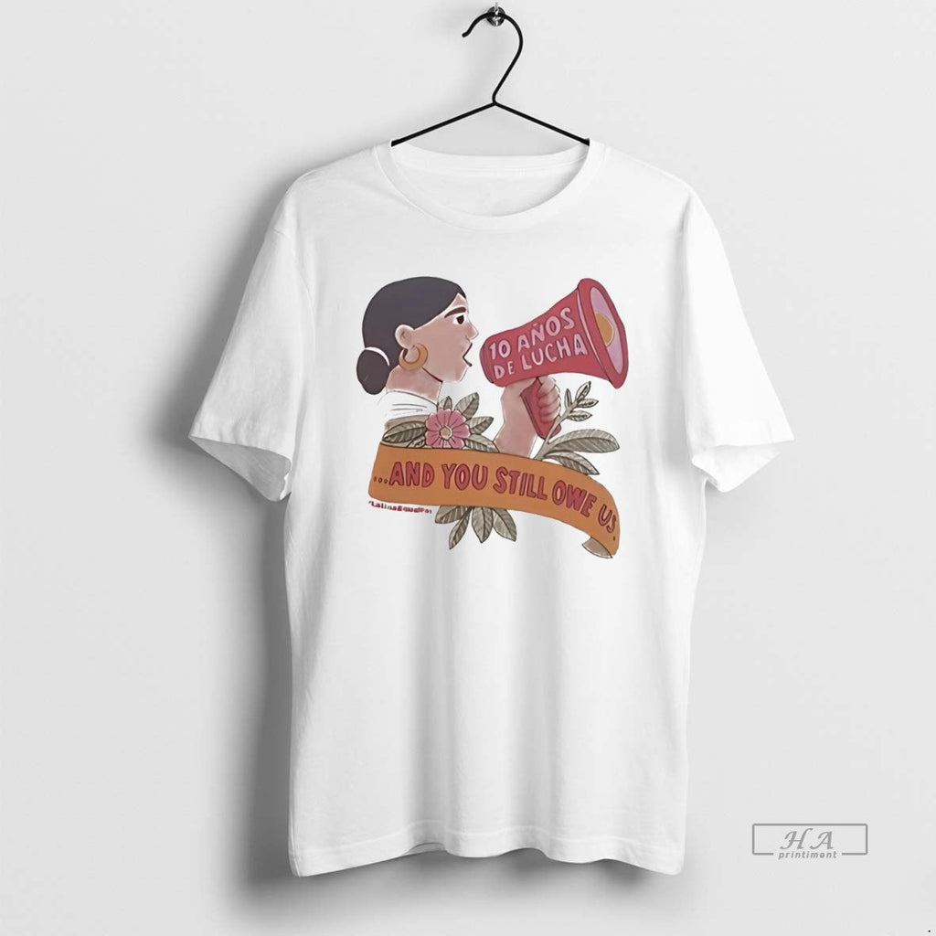 Official Trendy 10 Anos De Lucha And You Still Owe Us - Adult & Kids T-Shirts, Sweatshirts & Hoodies apparel design preview 1