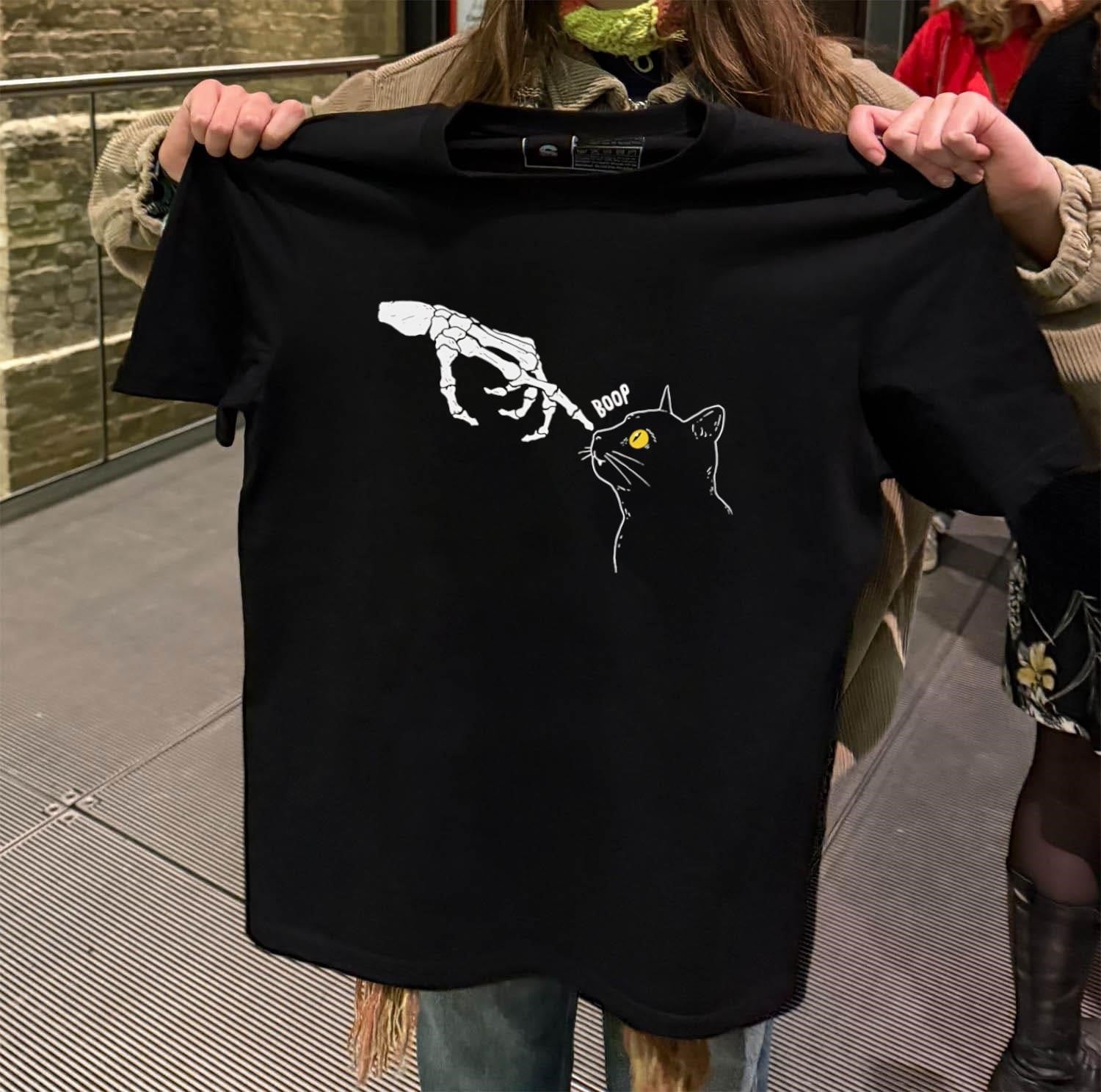 Skeleton hand touching black cat nose - Adult & Kids T-Shirts, Sweatshirts & Hoodies apparel design preview 2